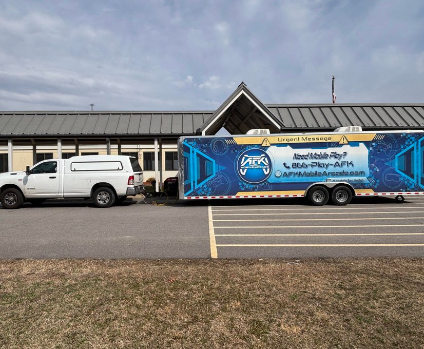 AFK Mobile Arcade truck and trailer in parking lot